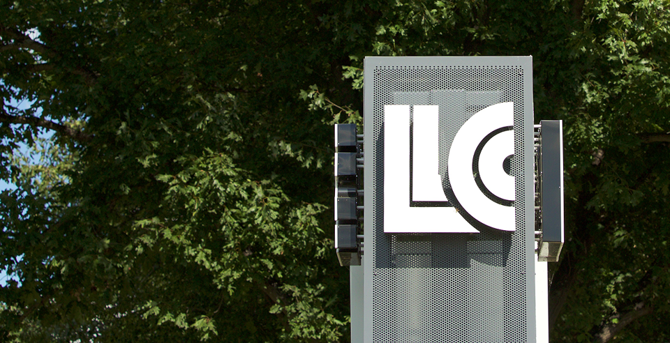 LLCC logo on outdoor campus sign