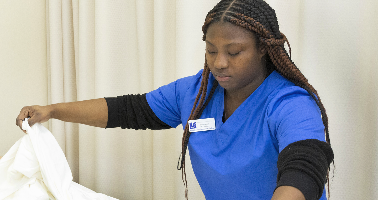 student washing patients hand