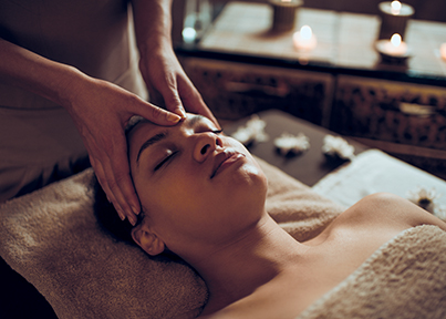 Women having forehead massaged