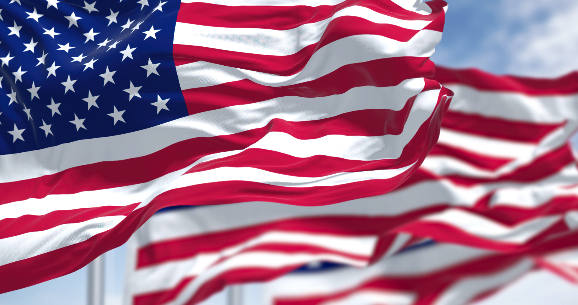 U.S.A flags on flagpoles waving in the wind