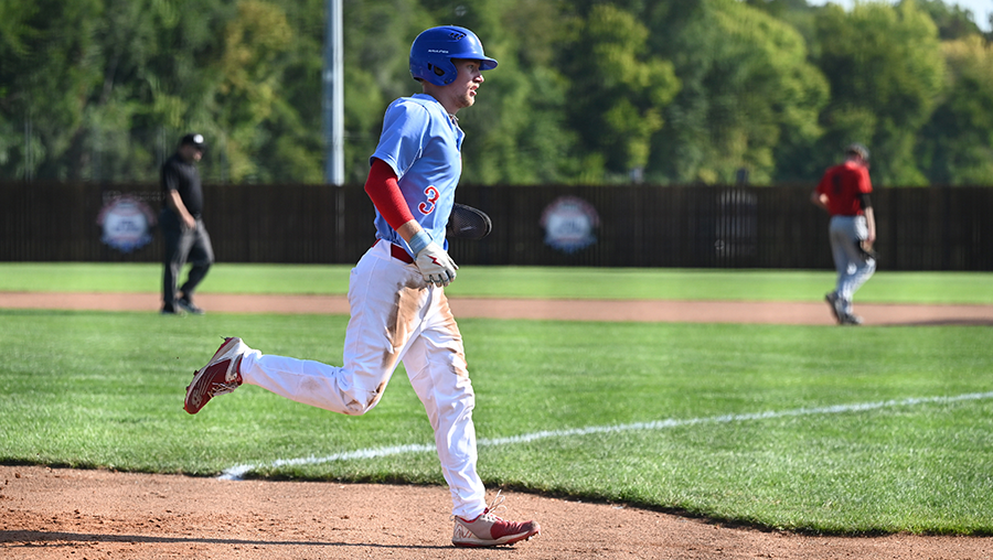 A Loggers baseball player runs the bases.