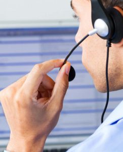 Computer support specialist talking on headset