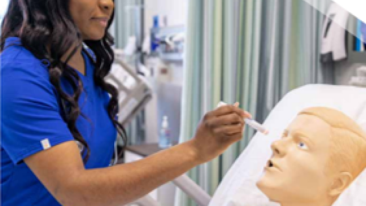 Amaris Gaines working with mannequin in nursing skills lab