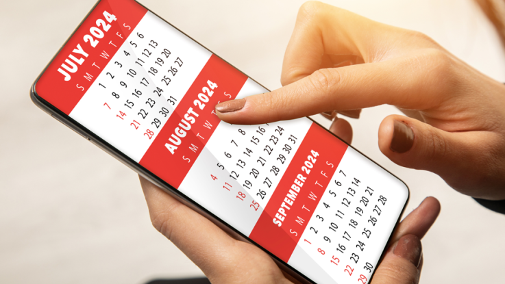 The months on a generic calendar are being scrolled through on a phone screen.