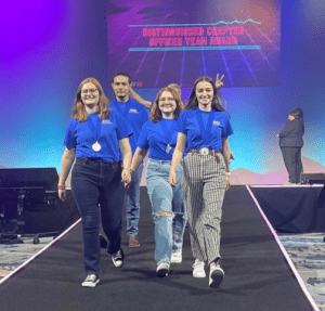 LLCC PTK officers walking down runway at national PTK convention