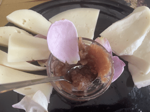 Rose petal jam on plate with cheese